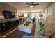 Spacious living room with open floor plan and a view of the kitchen and dining area at 41417 N Clear Crossing Rd, Anthem, AZ 85086