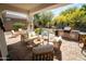 Relaxing backyard patio with seating area and built-in grill at 41417 N Clear Crossing Rd, Anthem, AZ 85086