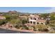 Luxury home with a tile roof and attached garage, nestled in a mountain community at 10728 E Cottontail Ln, Scottsdale, AZ 85255