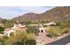 Elegant home nestled in a secluded mountain community with desert landscaping at 10728 E Cottontail Ln, Scottsdale, AZ 85255
