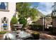 Charming courtyard with fountain and wrought iron gate at 10728 E Cottontail Ln, Scottsdale, AZ 85255
