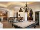 Game room with a pool table and a home bar at 10728 E Cottontail Ln, Scottsdale, AZ 85255