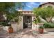Elegant entry gate with ornate ironwork leading to a courtyard at 10728 E Cottontail Ln, Scottsdale, AZ 85255