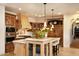 Gourmet kitchen with granite island and high-end appliances at 10728 E Cottontail Ln, Scottsdale, AZ 85255