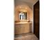 Elegant bathroom with light wood vanity, tile accents and a large mirror at 10728 E Cottontail Ln, Scottsdale, AZ 85255