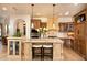 Spacious kitchen featuring a large island and wood cabinetry at 10728 E Cottontail Ln, Scottsdale, AZ 85255