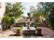 Peaceful courtyard with fountain and potted plants at 10728 E Cottontail Ln, Scottsdale, AZ 85255