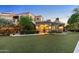 Landscaped backyard with a detached casita and lawn at 9926 E Kemper Way, Scottsdale, AZ 85255