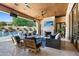 Relaxing outdoor patio with pool view and fireplace at 9926 E Kemper Way, Scottsdale, AZ 85255