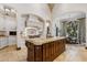 Open kitchen with large island, custom cabinetry, and breakfast nook at 9926 E Kemper Way, Scottsdale, AZ 85255