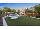 Large backyard with a pool, spa, and expansive lawn at 9926 E Kemper Way, Scottsdale, AZ 85255