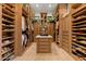 Large walk-in closet with custom built-ins and plenty of storage space at 9926 E Kemper Way, Scottsdale, AZ 85255