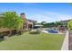 Resort-style pool and spa surrounded by lush landscaping at 9926 E Kemper Way, Scottsdale, AZ 85255