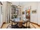 Charming breakfast nook with round table and four chairs, near the kitchen at 9926 E Kemper Way, Scottsdale, AZ 85255