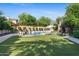 Inviting pool and spa area with lush landscaping and plenty of space for relaxation at 9926 E Kemper Way, Scottsdale, AZ 85255