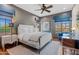 Spacious bedroom with a large bed and hardwood floors at 9926 E Kemper Way, Scottsdale, AZ 85255