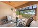 Spacious patio with pergola, comfortable seating, and mountain views at 9926 E Kemper Way, Scottsdale, AZ 85255