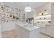 Laundry room with marble countertops and floral wallpaper at 9926 E Kemper Way, Scottsdale, AZ 85255