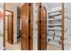 Well-organized linen closet with ample shelving at 9926 E Kemper Way, Scottsdale, AZ 85255
