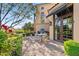 A quaint patio with seating area adjacent to the house at 9926 E Kemper Way, Scottsdale, AZ 85255