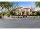 Luxury home exterior at dusk, beautifully lit at 9926 E Kemper Way, Scottsdale, AZ 85255