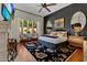 Spacious main bedroom with a large bed, fireplace, and plenty of natural light at 9926 E Kemper Way, Scottsdale, AZ 85255