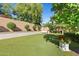 Landscaped backyard with a serene atmosphere and plenty of green space at 9926 E Kemper Way, Scottsdale, AZ 85255