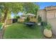 Charming patio with a table and chairs, ideal for outdoor dining at 9926 E Kemper Way, Scottsdale, AZ 85255