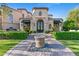 Elegant home exterior with ornate entryway and landscaping at 9926 E Kemper Way, Scottsdale, AZ 85255