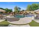 Luxury pool and spa with fountains and plenty of lounge space for entertaining at 9926 E Kemper Way, Scottsdale, AZ 85255