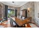 Elegant dining room with large table, chandelier, and patterned wallpaper at 9926 E Kemper Way, Scottsdale, AZ 85255