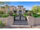 Ornate iron gates and entry to this beautiful home at 9926 E Kemper Way, Scottsdale, AZ 85255
