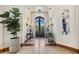 Elegant entryway with high ceilings and wrought iron doors at 9926 E Kemper Way, Scottsdale, AZ 85255