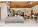 Covered patio with fireplace, seating, and outdoor kitchen at 9926 E Kemper Way, Scottsdale, AZ 85255