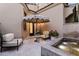 Charming courtyard with fountain, seating area, and umbrella at 9926 E Kemper Way, Scottsdale, AZ 85255
