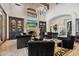 Open living space with ample seating and a fireplace at 9926 E Kemper Way, Scottsdale, AZ 85255