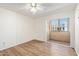 Bedroom features wood-look floors and ceiling fan at 3002 N 70Th St # 239, Scottsdale, AZ 85251