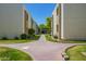 Pathway meanders through a well-maintained community with grassy areas and buildings at 3002 N 70Th St # 239, Scottsdale, AZ 85251