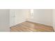 Bright bedroom with wood-look floors and a private balcony at 3002 N 70Th St # 239, Scottsdale, AZ 85251