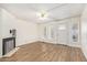 Living room with hardwood floors, fireplace and door to patio at 3002 N 70Th St # 239, Scottsdale, AZ 85251
