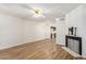 Living room with hardwood floors and fireplace, view to kitchen at 3002 N 70Th St # 239, Scottsdale, AZ 85251