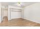 Bedroom with wood-look floors and access to hallway at 3002 N 70Th St # 239, Scottsdale, AZ 85251