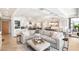 Bright living room featuring a large sectional sofa and an open floor plan at 7117 E Rancho Vista Dr # 4011, Scottsdale, AZ 85251