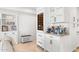 White shaker cabinets, wine cooler, and built-in bar area at 7117 E Rancho Vista Dr # 4011, Scottsdale, AZ 85251