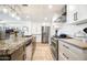 Modern kitchen with granite countertops, stainless steel appliances, and ample cabinetry at 7117 E Rancho Vista Dr # 4011, Scottsdale, AZ 85251
