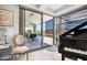Elegant living room with patio access and grand piano at 7117 E Rancho Vista Dr # 4011, Scottsdale, AZ 85251