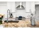 Modern kitchen with geometric backsplash and stainless steel appliances at 7117 E Rancho Vista Dr # 4011, Scottsdale, AZ 85251
