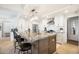 Open concept kitchen with granite island and breakfast bar at 7117 E Rancho Vista Dr # 4011, Scottsdale, AZ 85251