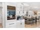 Modern kitchen with granite countertops and a built-in wine cooler at 7117 E Rancho Vista Dr # 4011, Scottsdale, AZ 85251