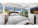 Comfortable bedroom with a queen-size bed and large windows at 7117 E Rancho Vista Dr # 4011, Scottsdale, AZ 85251